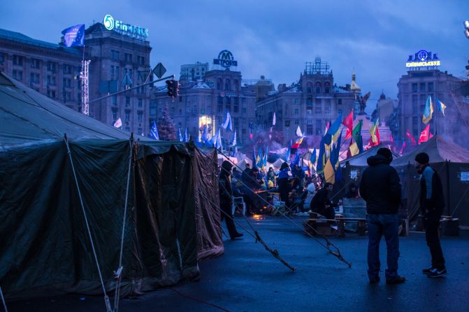 Anti-government protesters camp in Independence Square early in the morning on December 8.