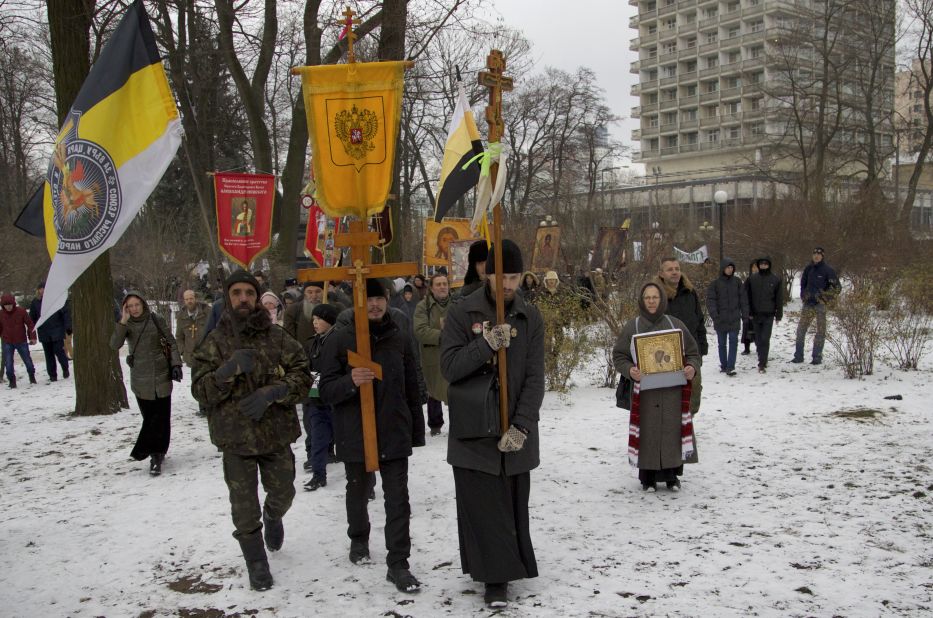 Orthodox believers, carrying icons and crosses, walk during a religious procession outside the parliament building in Kiev on December 6.