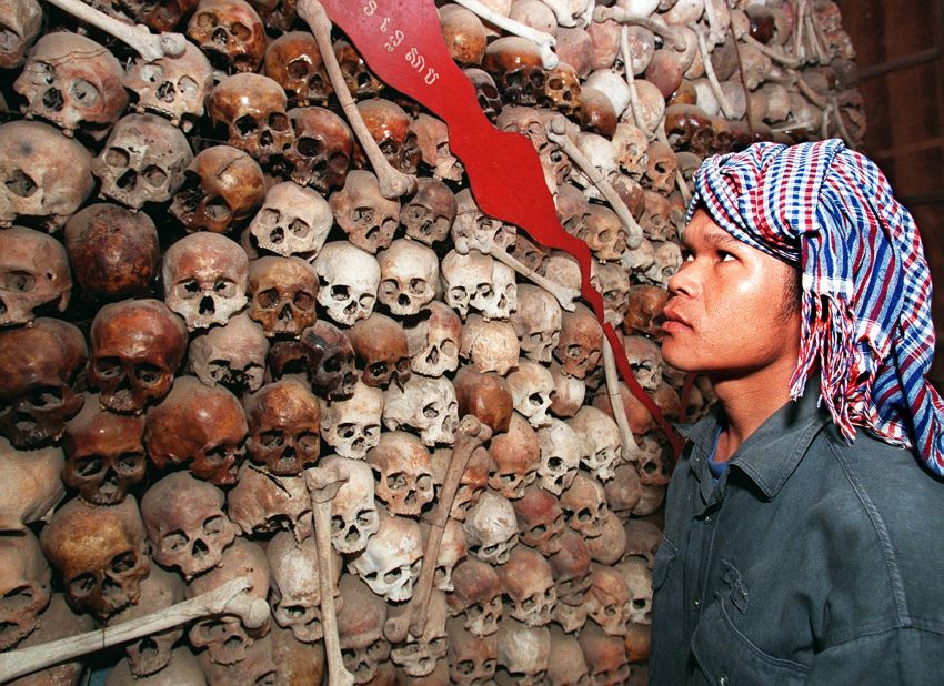 Cambodian citizen Sam Vishna looks at a collection of skulls that make up a map of Cambodia at Tuol Sleng Prison Museum in Phnom Penh in 1998.