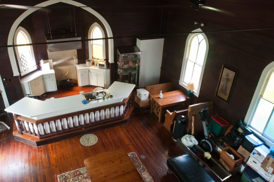 Johnson installed the kitchen in the altar and a breakfast nook made from old pews in the church.