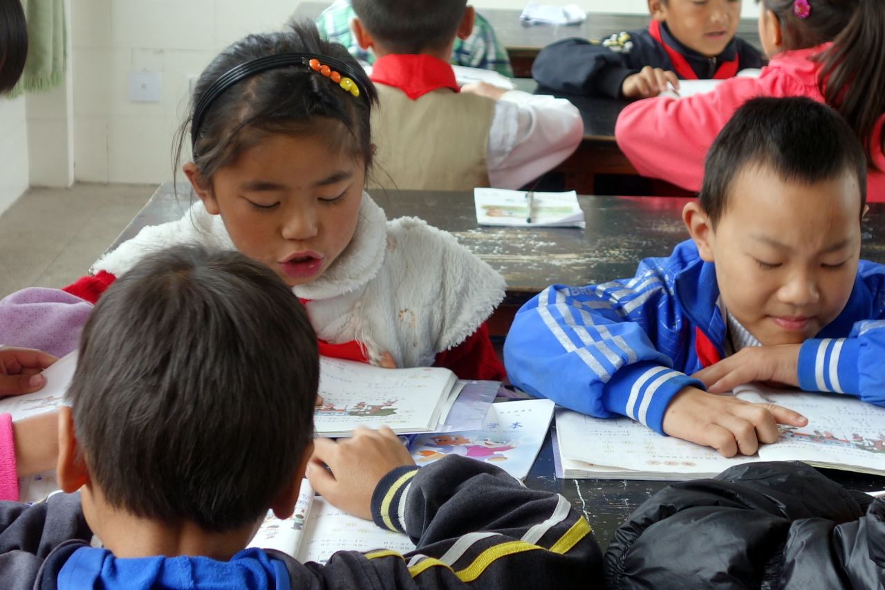 Pupils work on a math exercise at Shahe Primary School, in a village near the county seat of Tengchong, a remote region in China's Yunnan province.