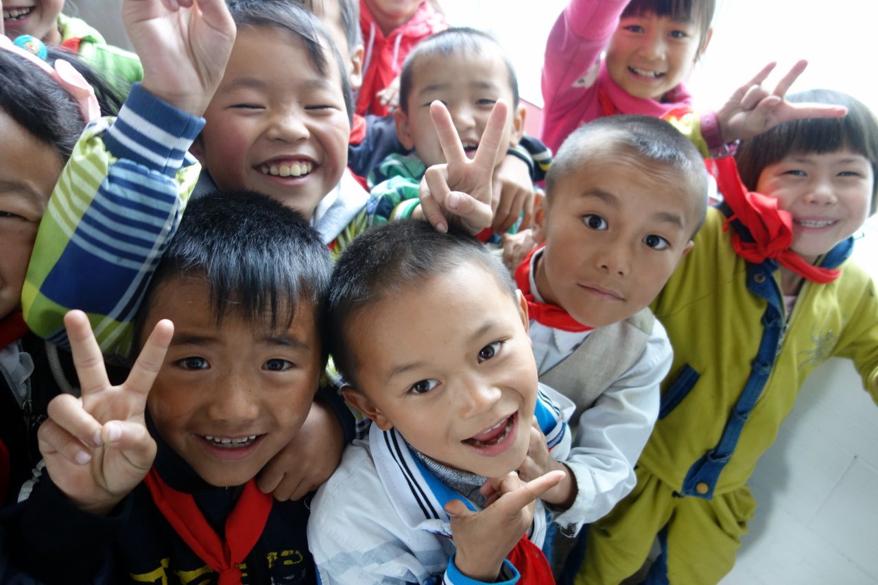 Pupils squeeze in for a group photo. The students exuded pent-up energy and hunger for knowledge.