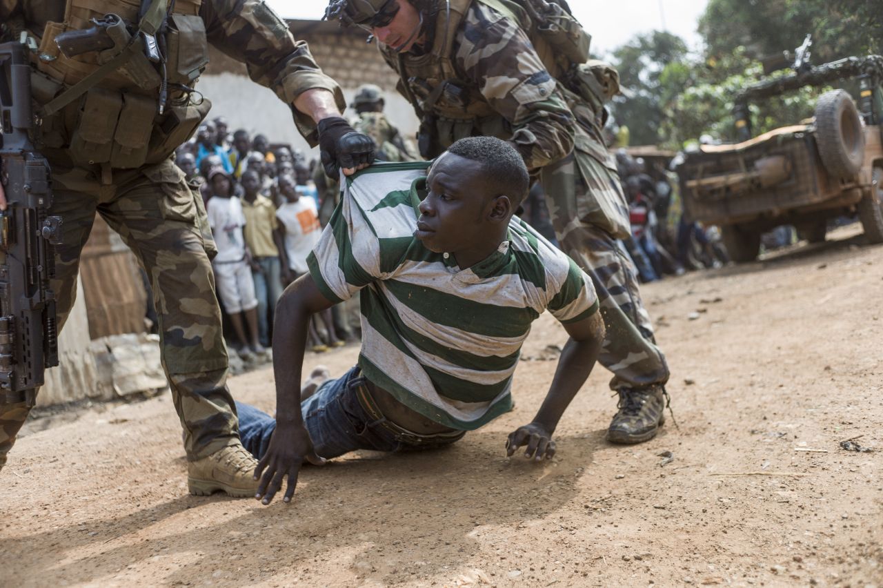 French soldiers arrest an alleged ex-Seleka rebel in a neighborhood near the Bangui airport on December 9.