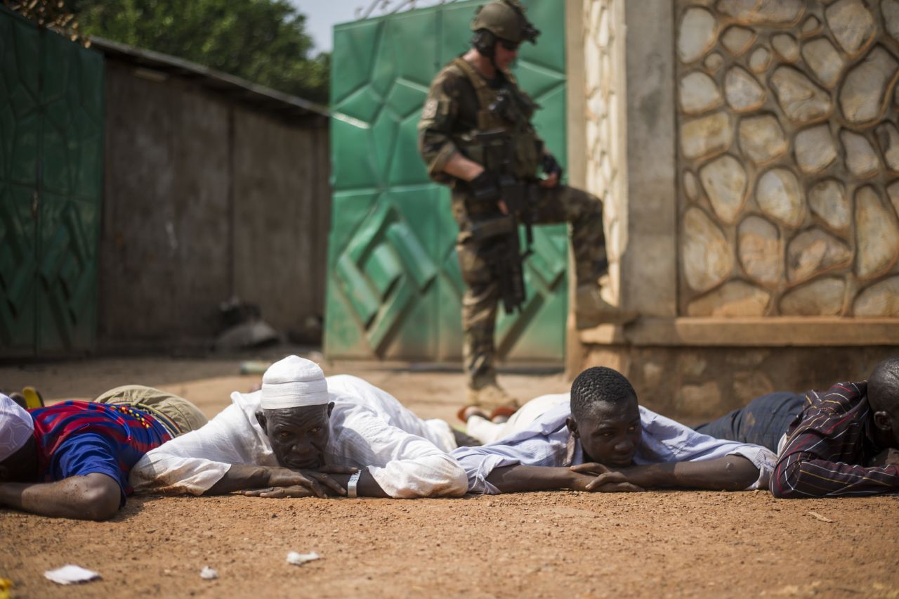 A French soldier stands guard after the arrest of ex-Seleka rebels in a neighborhood near Bangui's airport on December 9.