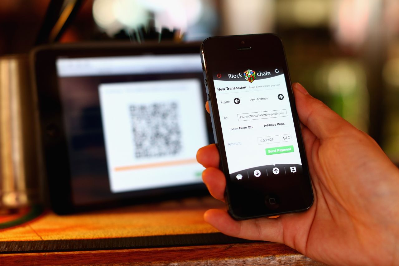 Customers scan a QR code to pay for drinks or food using Bitcoins at the Old Fitzroy in Sydney -- the first pub to accept the virtual coins in Australia. 