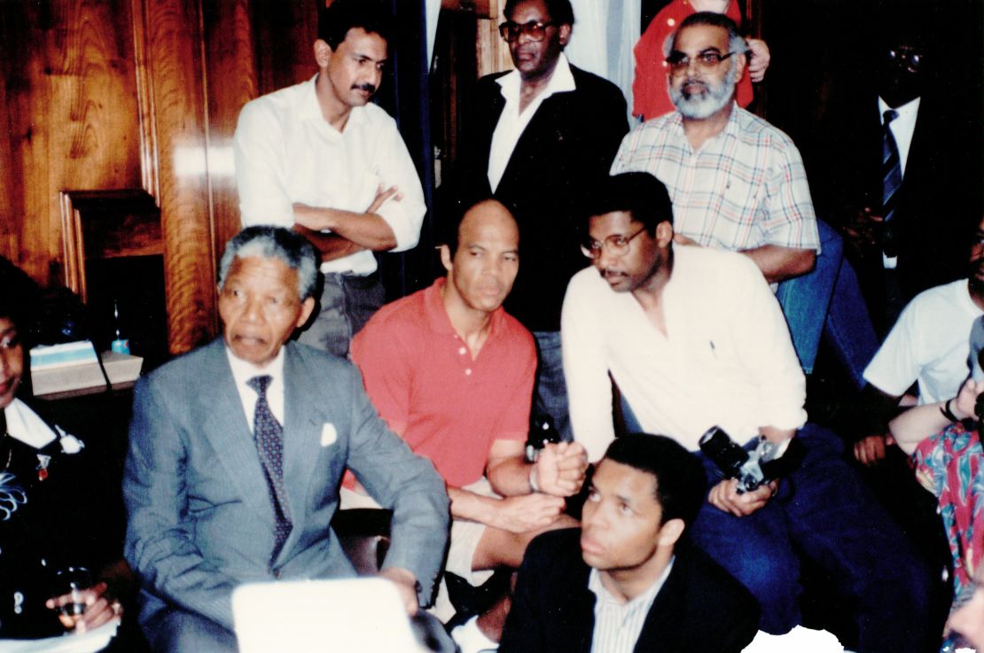 Author Sylvester Monroe, with glasses, meets with Nelson Mandela in Cape Town, South Africa, in 1990.