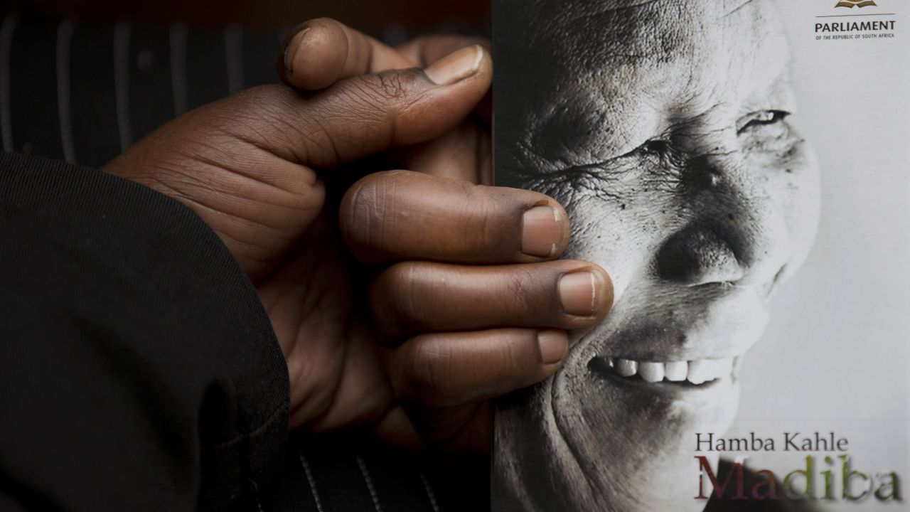 A man clutches the official program in Johannesburg.