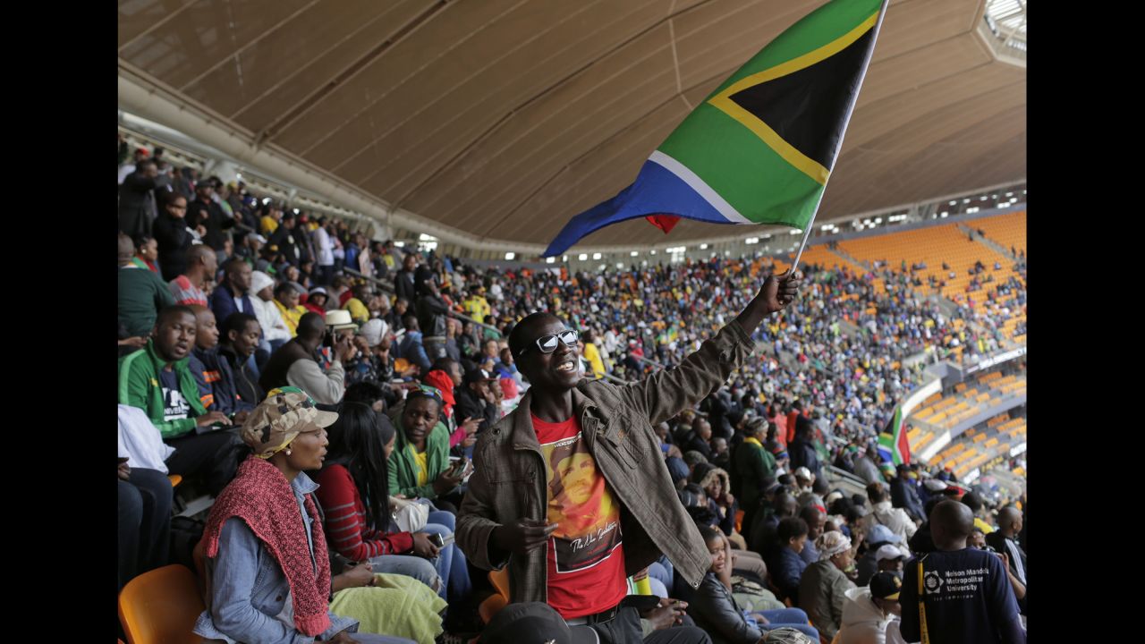 A man waves a South African flag at FNB Stadium.