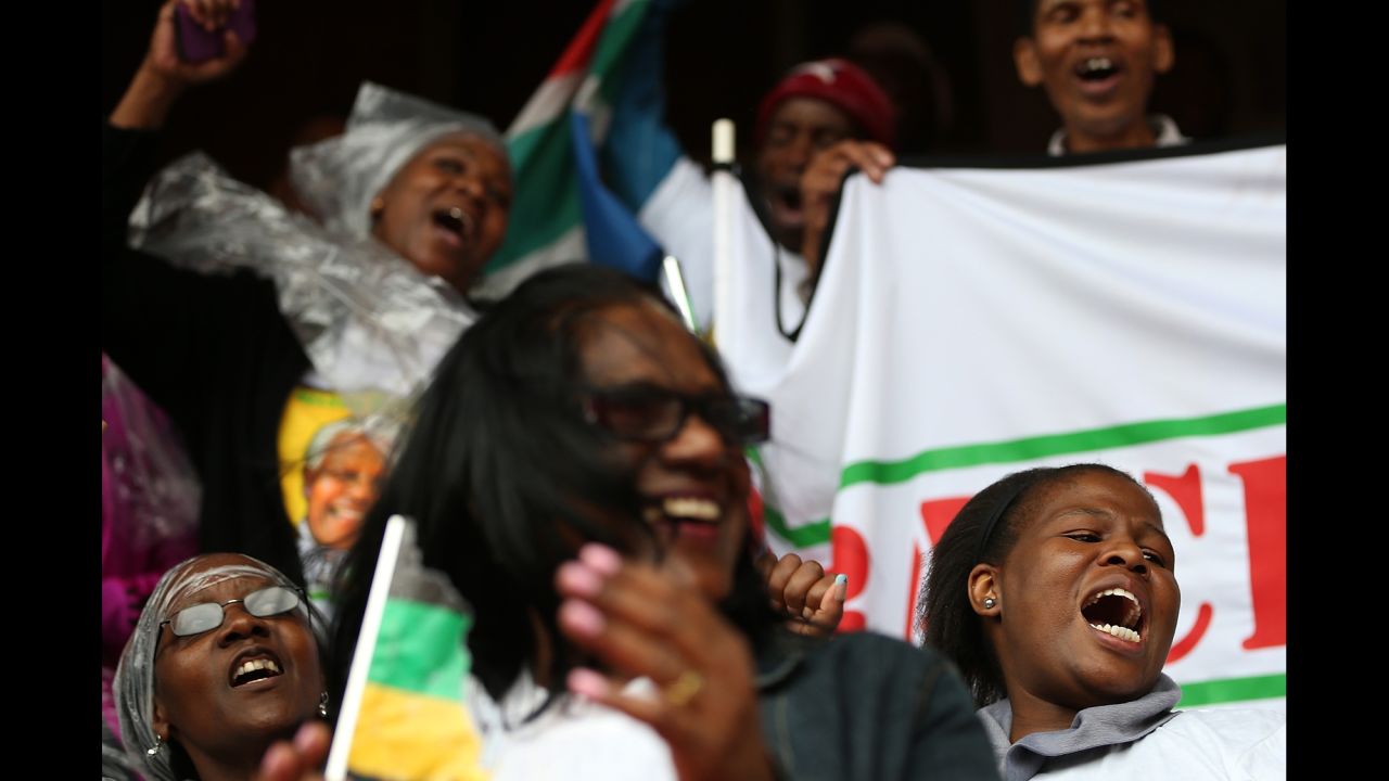 People sing and dance at Ellis Park in Johannesburg.