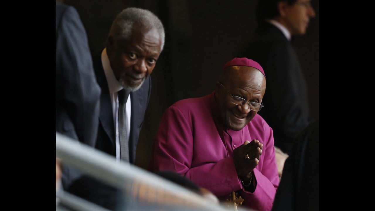 Former Archbishop Desmond Tutu, right, arrives with former U.N. Secretary-General Kofi Annan at FNB Stadium.