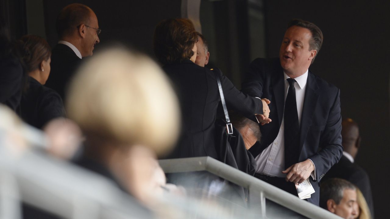 British Prime Minister David Cameron arrives for the memorial service.
