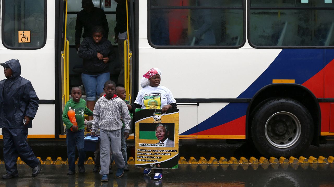 Members of the public make their way to the memorial service at FNB Stadium.