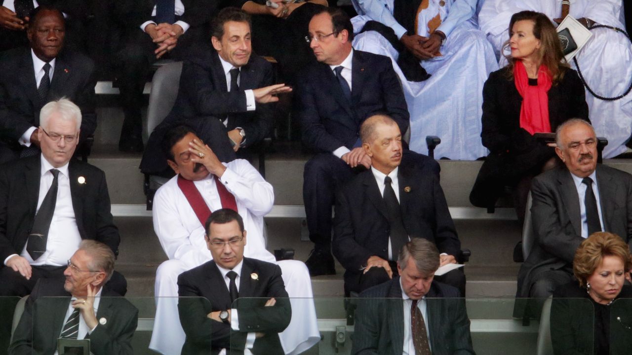 World leaders, including former French President Nicolas Sarkozy, top second left, and French President Francois Hollande, top second right, attend the memorial service.