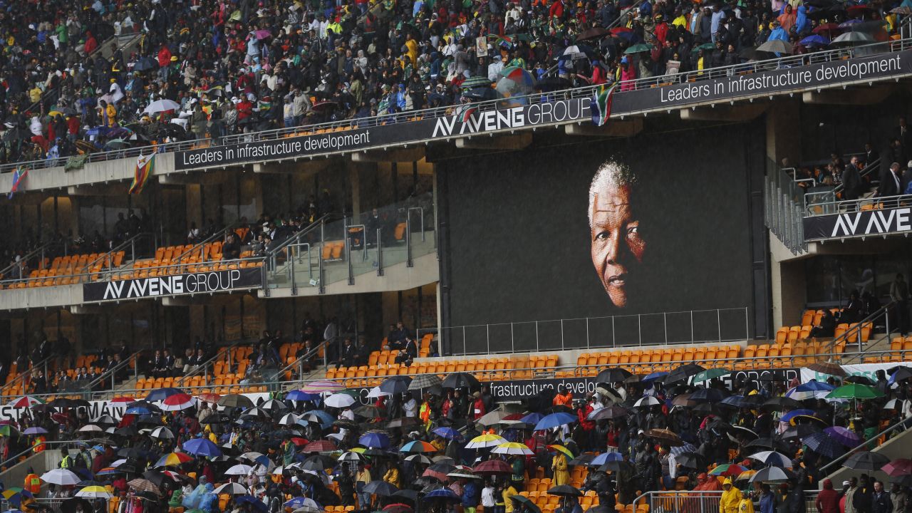 Mandela's face looms large on a billboard inside FNB Stadium.