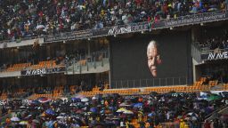 The face of Mandela is shown on a large billboard inside FNB Stadium during the memorial service.
