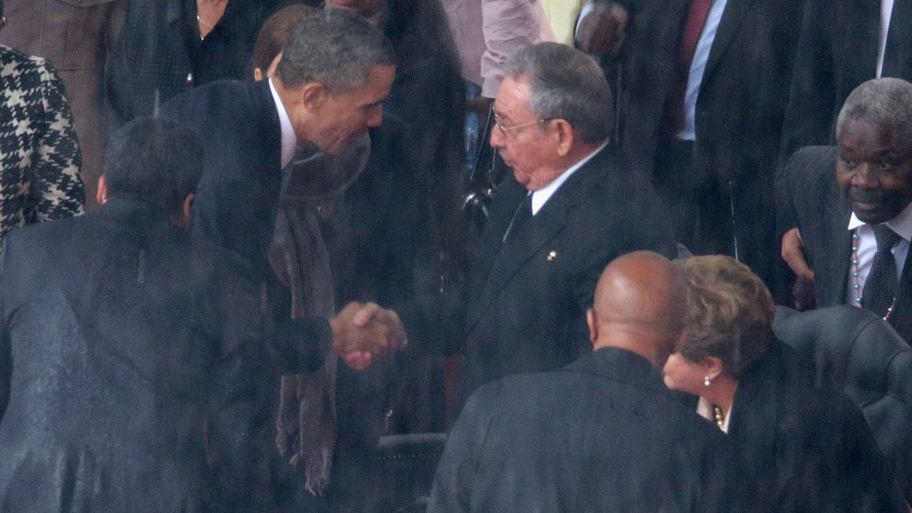 Obama shakes hands with Cuban President Raul Castro just before speaking.