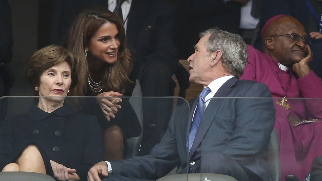 Queen Rania of Jordan speaks with former President George W. Bush and his wife, Laura, during the memorial service.