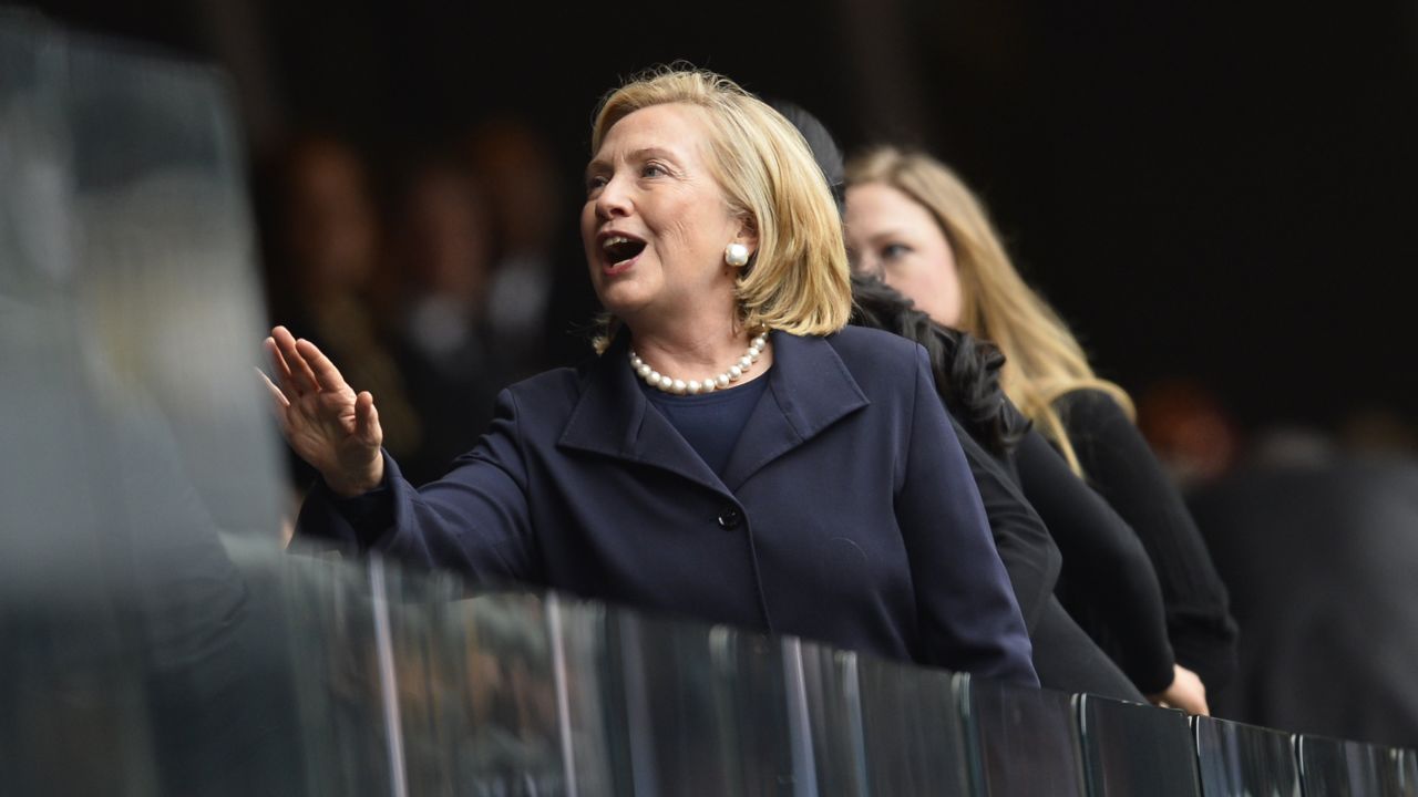 Former Secretary of State Hillary Clinton arrives for the memorial service.