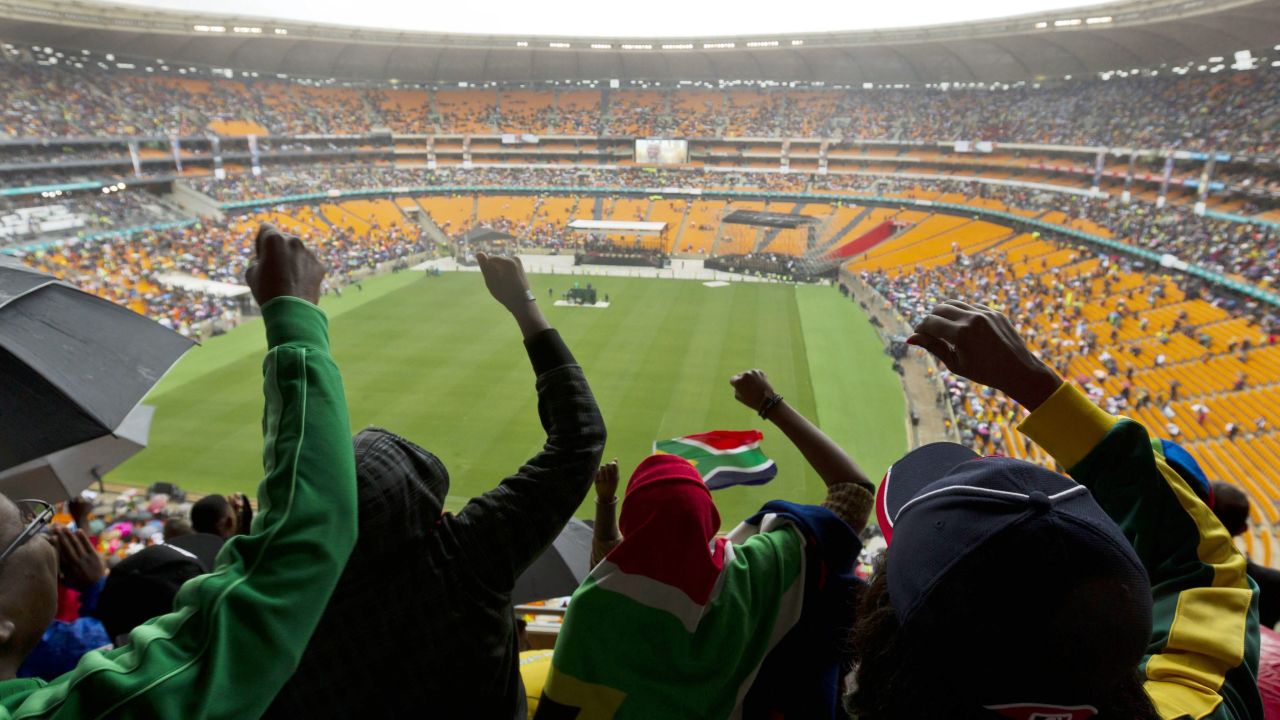 South Africans cheer during the memorial service.
