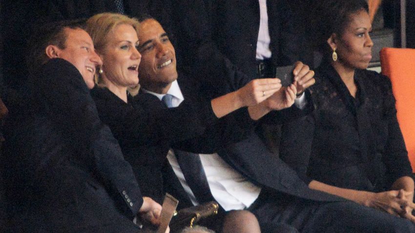Denmark's Prime Minister Helle Thorning-Schmidt snaps a selfie with British Prime Minister David Cameron and U.S. President Barack Obama during the memorial service of South African former president Nelson Mandela in Johannesburg, South Africa on December 10.
