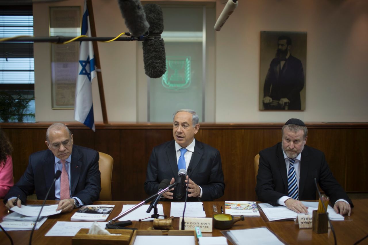 The office of Israeli Prime Minister Benjamin Netanyahu, center, said that the short notice made security arrangements difficult and that the high cost of the trip proved prohibitive. A delegation headed by Knesset Speaker Yuli Edelstein is representing Israel.