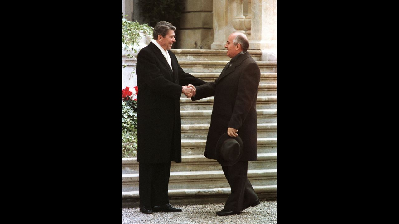 U.S. President Ronald Reagan, left, and Soviet leader Mikhail Gorbachev meet for the first time before summit talks on nuclear disarmament at the villa Fleur D'Eau a Versoix near Geneva, Switzerland, on November 19, 1985.