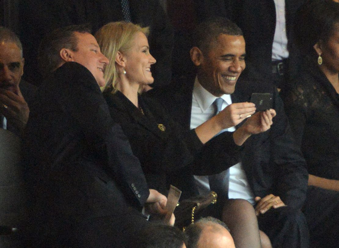 The three world leaders share a photo at Mandela's memorial.
