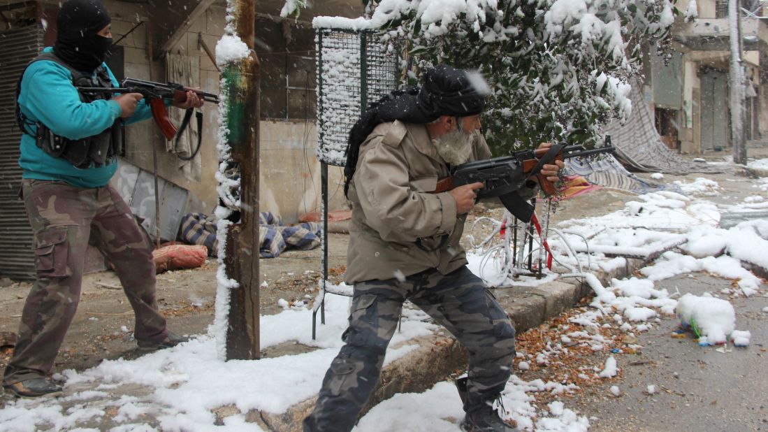 Syrian rebel fighters clash with pro-government forces in Aleppo on Wednesday, December 11.