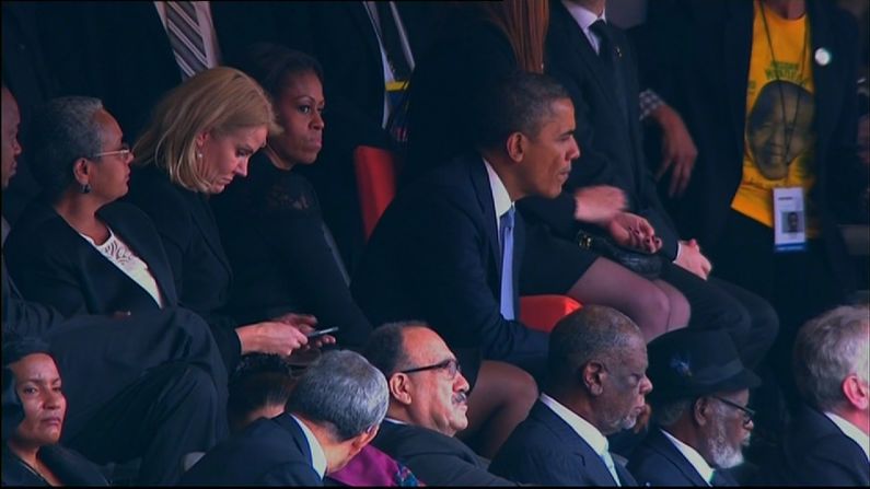 Later on for reasons unknown, and it may have been when the president left to give his speech, the Obamas swap places so the First Lady sits between the two leaders.