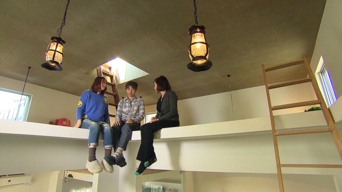 Hanae Terado, left, and her husband Tatsumi, center, at their "Ninja" home