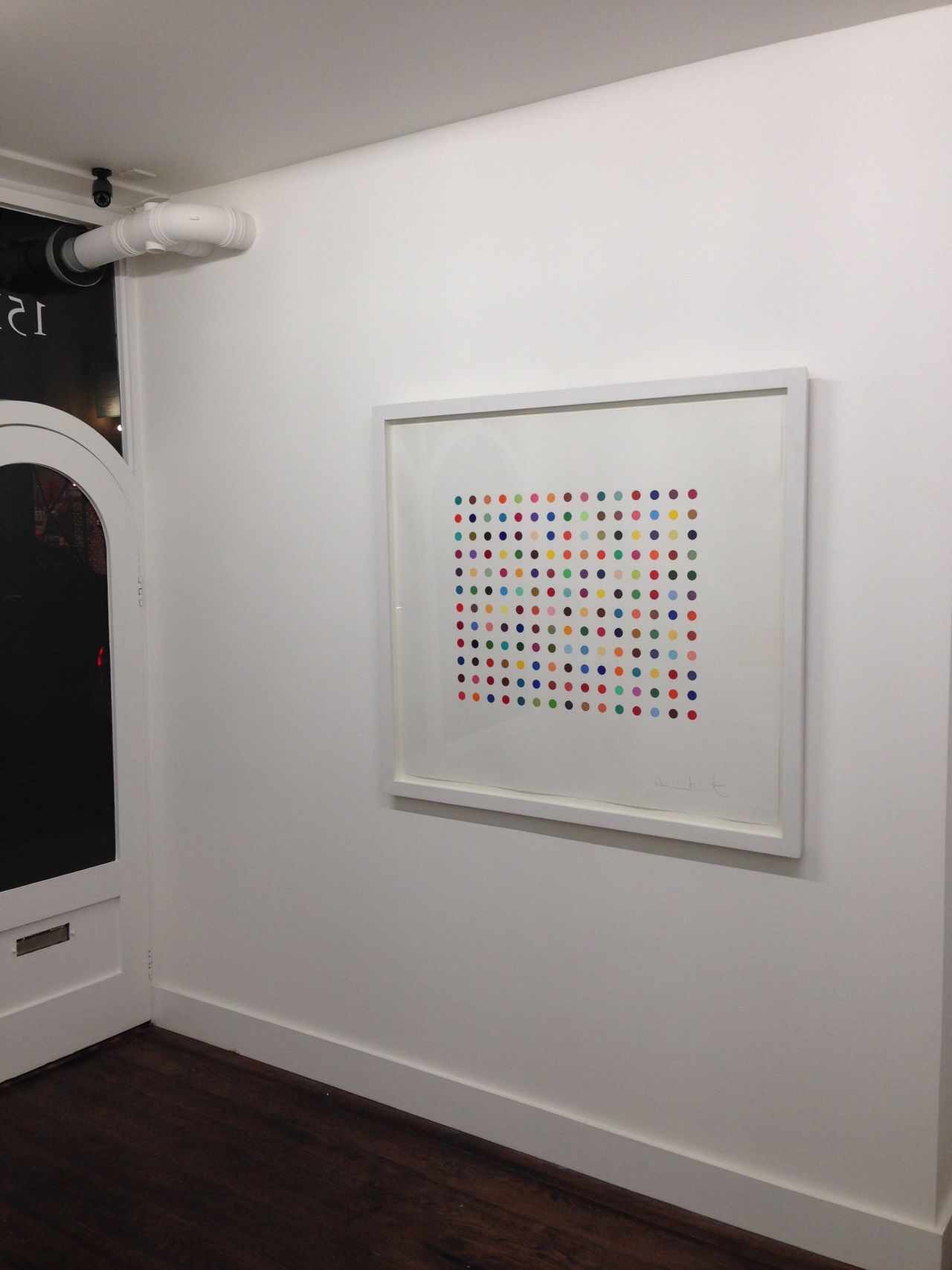 Two artworks by Damien Hirst have been stolen from a London Gallery. "Pyronin Y", seen hanging in the Exhibitionist Gallery before the theft on December 9, 2013, is worth £15,000 ($24,565).