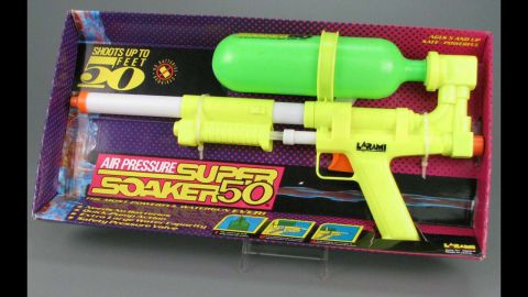 Super Soaker 50 water pistol by Larami Corp. in 1990. The year was 1989: Children were still throwing around archaic water balloons until Lonnie Johnson, a nuclear engineer, came up with the idea of a high-powered toy water gun. It was originally called the "Power Drencher," and Johnson started a whole new era of backyard water fights. The Super Soaker 50 didn't require batteries and was one of the most powerful water guns on the market. 