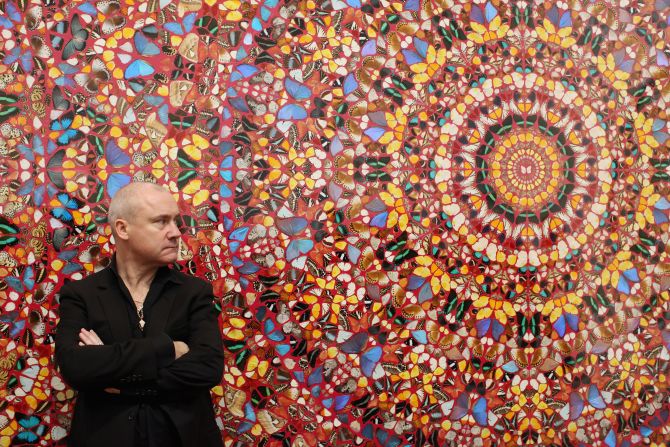 Hirst, possing in front of his artwork "I am Become Death, Shatterer of Worlds" at London's Tate Modern on April 2, 2012, rose to fame in the 1990s as one of the Young British Artists, or YBAs, along with Tracey Emin, Sarah Lucas and Jake and Dinos Chapman. 