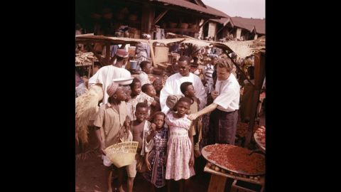 Graham visits with children during a trip to Ghana in 1960.