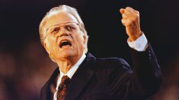 Graham gestures during his message to the capacity crowd at Ericsson Stadium in Charlotte, North Carolina, on September 27, 1996.