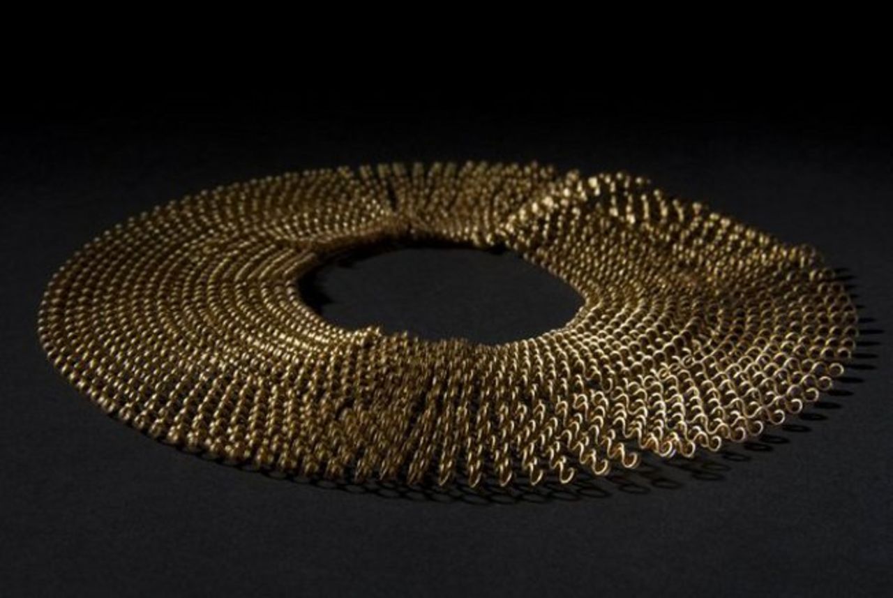 French designer Florie Salnot's recycled plastic necklace, titled <em>Plastic Gold, </em>is a product of her work with women from western Sahara. Inspired by the traditional jewelery worn by these women, Salnot has devised a craft they can practice despite their limited resources.<em> </em>