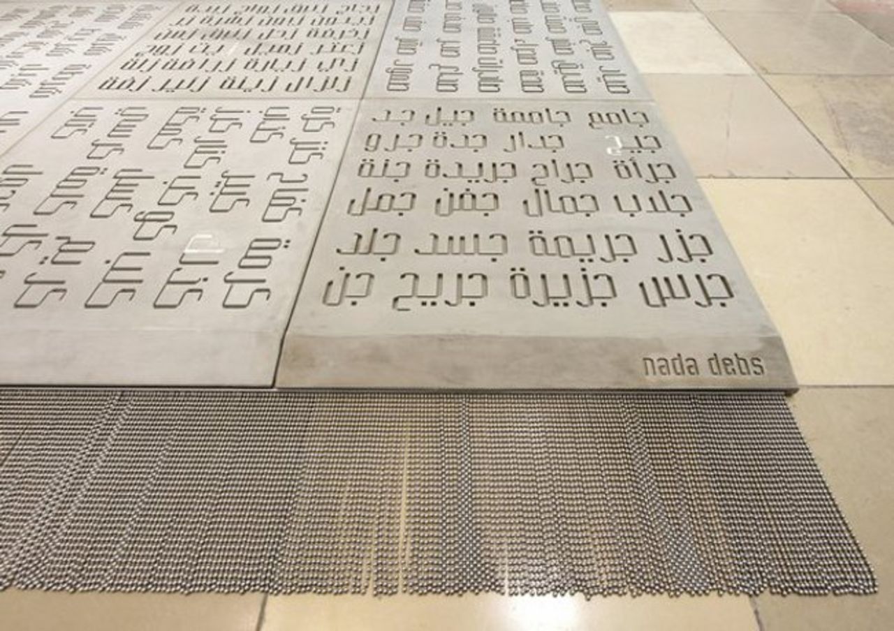Japanese furniture and product designer Nada Debs blends Middle Eastern craftsmanship with Japanese minimalism. Her <em>Concrete Carpet </em>(detail)<em> </em>combines a light-weight form of concrete with Arabic font design.