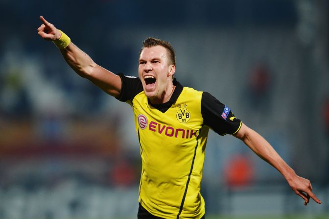 Kevin Grosskreutz scored a late goal for Borussia Dortmund against Marseille to give the German side a vital win in Champions League Group F. The 2-1 victory coupled with Arsenal's 2-0 loss against Napoli means last year's beaten finalists finish top of the group.