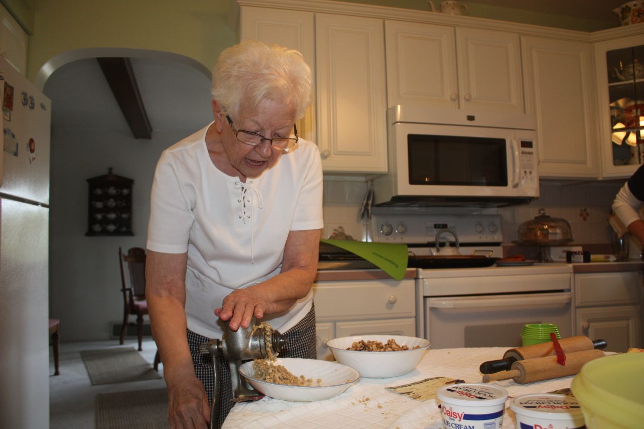 Bodnar's aunt Eleanor long held the unofficial family title as best nut roll maker. She took care to pass the craft to her daughter. Here, his aunt Carolyn grinds the nuts for the kolachi.
