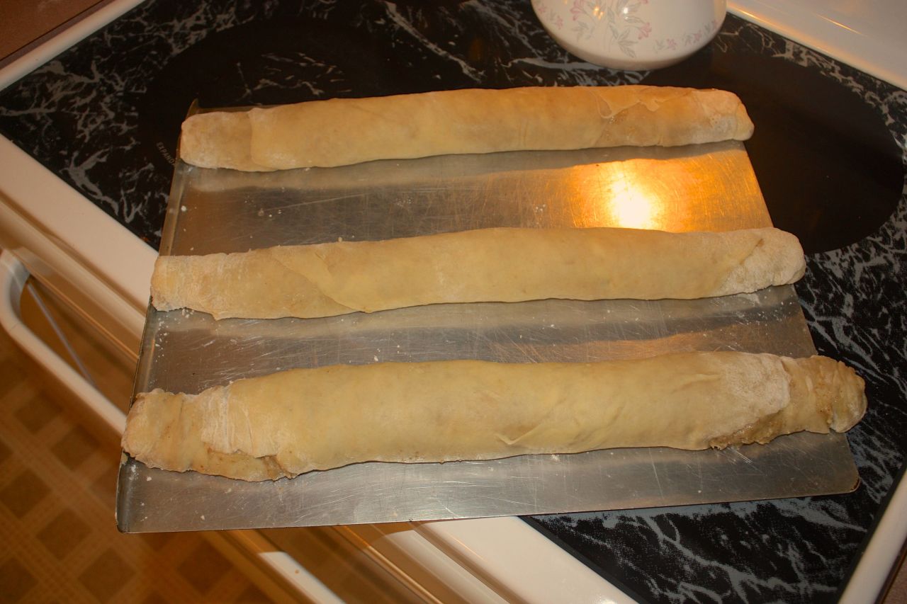 A pinch or push in the ends of the roll helps the filling stay sealed during baking and slicing.