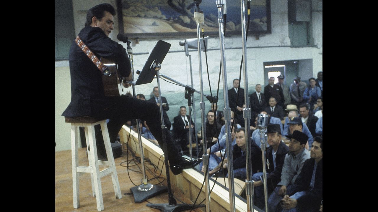 Cash performs for prisoners at Folsom Prison in California on January 13, 1968.  The performance was recorded for his live album "Johnny Cash at Folsom Prison." 
