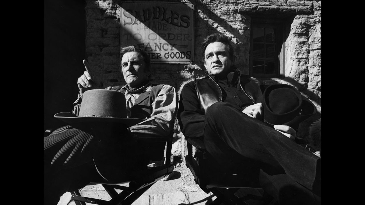 Kirk Douglas, left, and Cash film an episode of "The Johnny Cash Show" in Arizona on January 13, 1971.