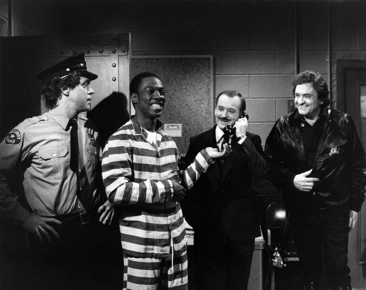 Joe Piscopo, from left, Eddie Murphy, Brian Doyle-Murray, and Johnny Cash perform a "Saturday Night Live" skit on April 17, 1982.