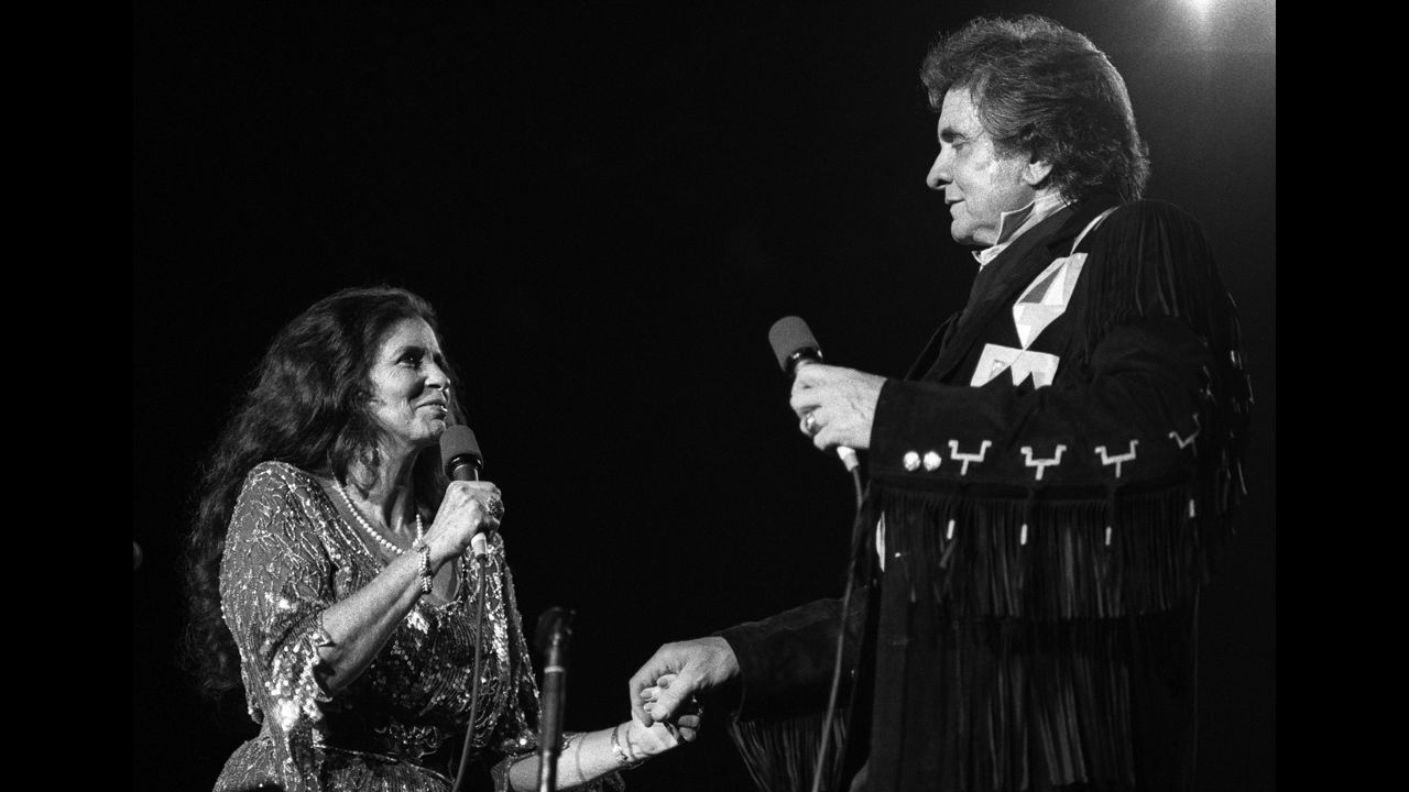 June Carter Cash and Johnny Cash perform on September 3, 1987.