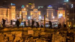 Anti-government protesters use snow to reinforce a barricade blocking street access to Independence Square, known as the Euromaidan, on December 11, 2013 in Kiev, Ukraine.