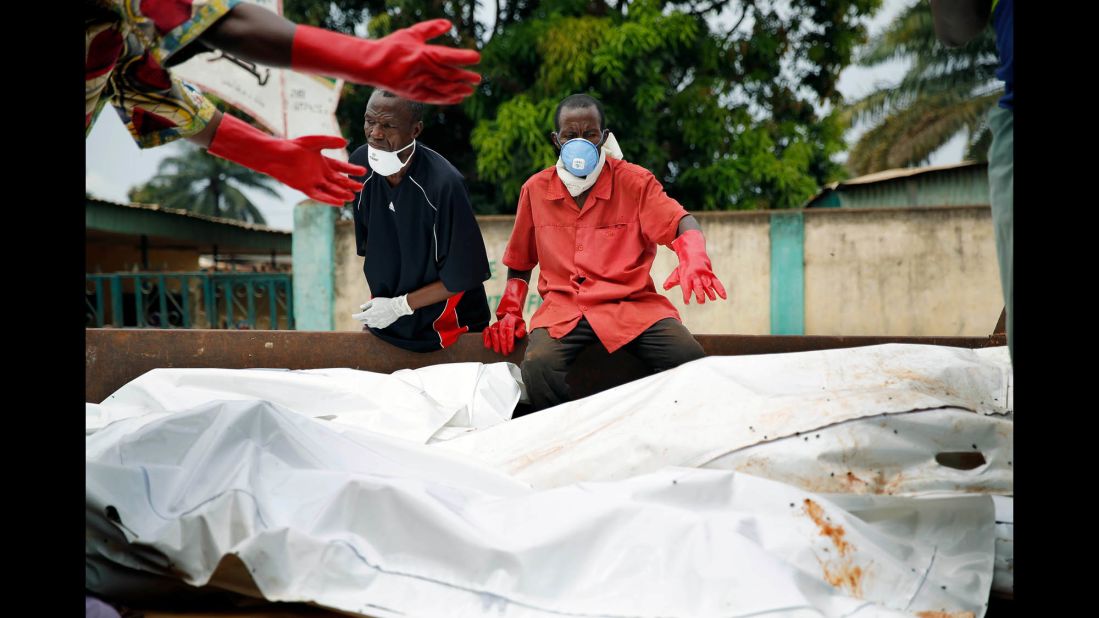 The bodies of 16 Muslim men are loaded onto a truck at the Nour Islam Mosque before being transported for burial in Bangui on Wednesday, December 11.