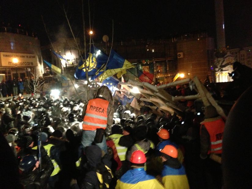 KIEV, UKRAINE:  Ukrainian riot police storm barricades set up by pro-European Union protesters in Independence Square on December 11. Ukrainian security forces stormed the square, which protesters have occupied for three weeks. The demonstrators defiantly refused to leave and resisted the police in a tense standoff.  Photo by CNN's Diana Magnay.