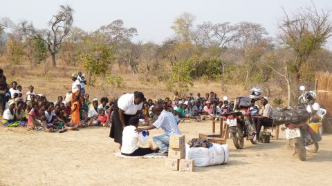 A group of health workers in Mantanyani village, Southern Province, in Zambia, provide a health education lesson to local people about the importance of using water treatment kits.