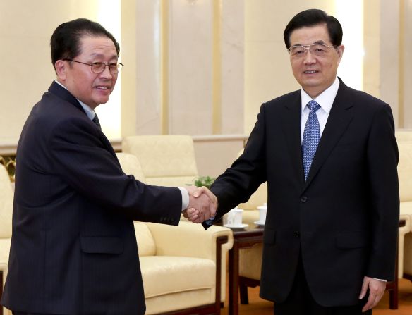 Chinese President Hu Jintao, right, greets Jang in Beijing on August 17, 2012. Jang met China's President and Premier in an effort to improve the relations between the two countries after Kim Jong Un irked Beijing with a rocket launch soon after taking power.