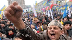 A man shouts slogans during a mass rally called 'The March of a Million' on Kiev's Independence Square on December 8, 2013.